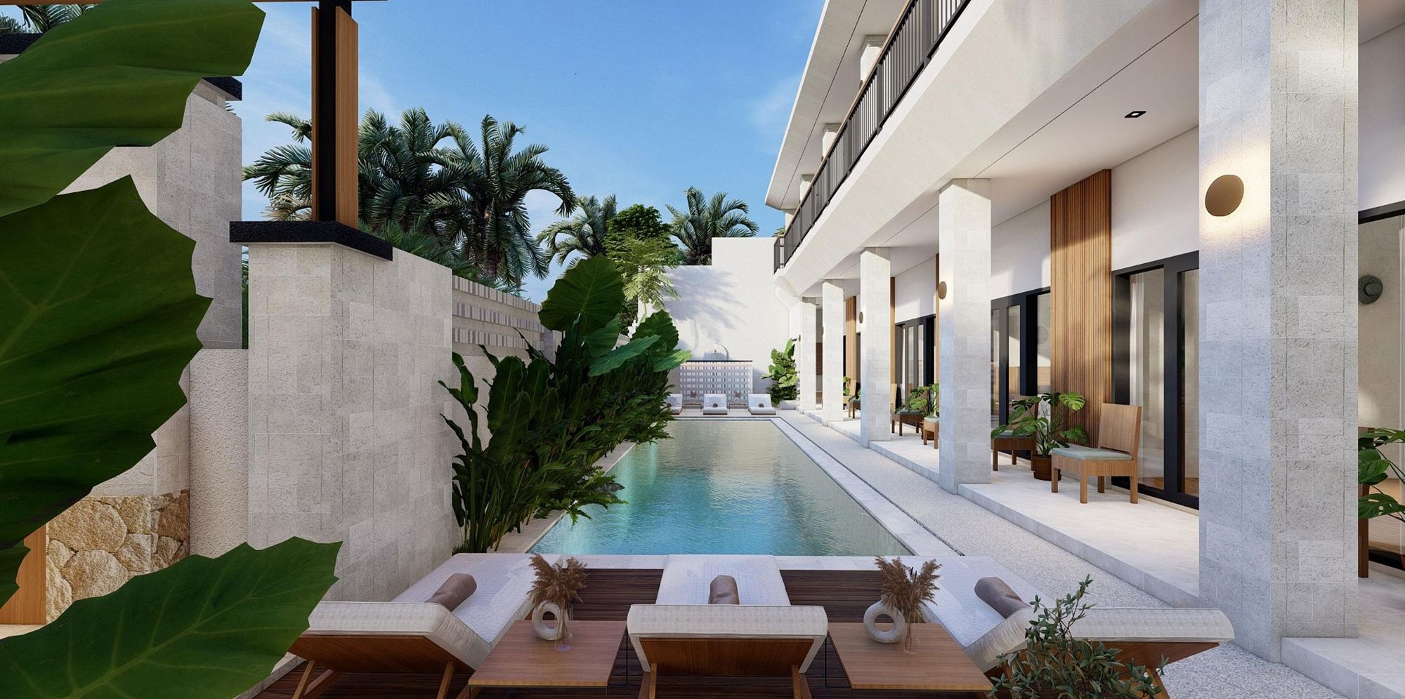 Lap pool lined with sun loungers at Slo Suites, Berawa