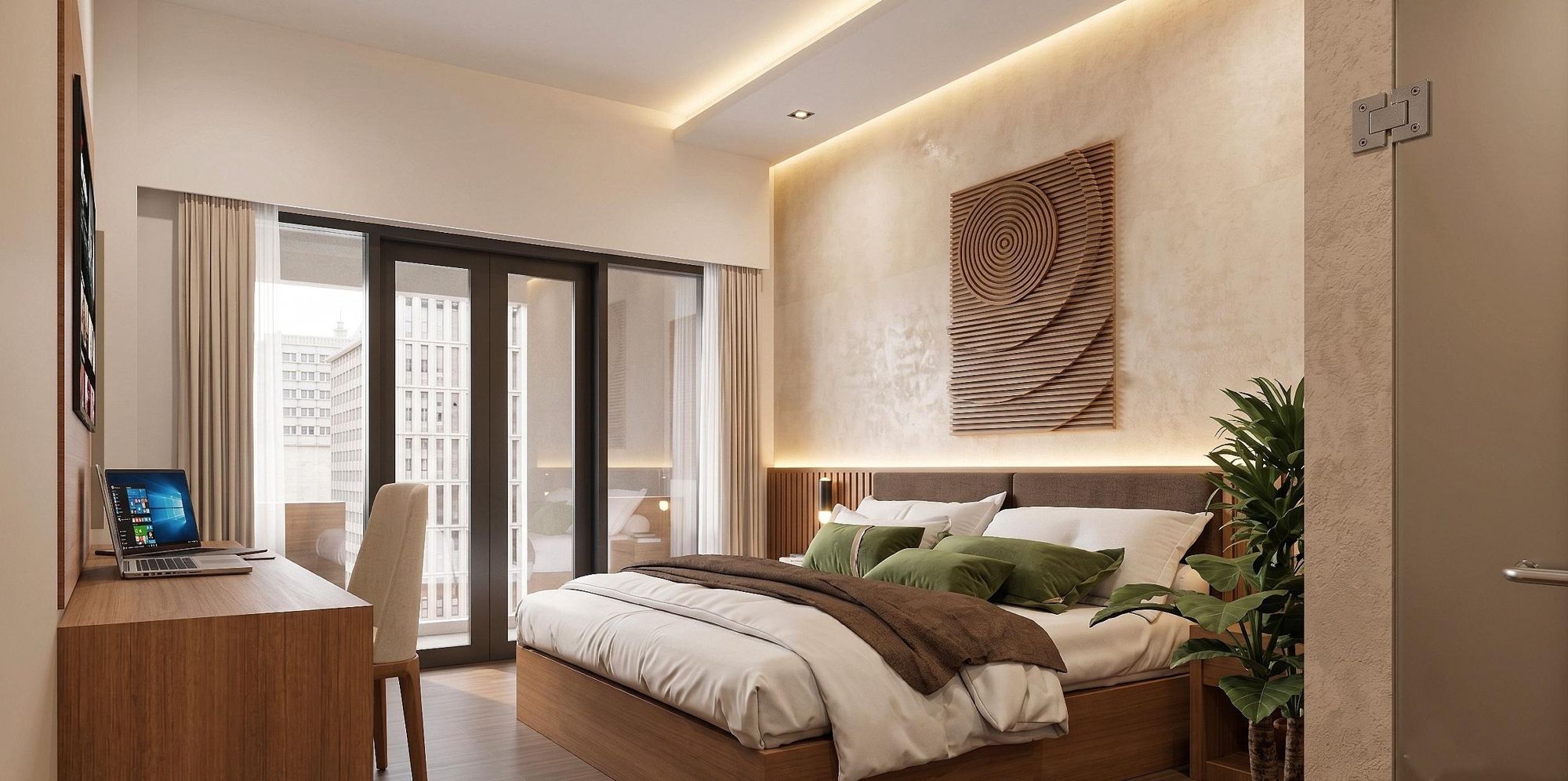 Queen standard suite with a laptop on the working table and a queen bed